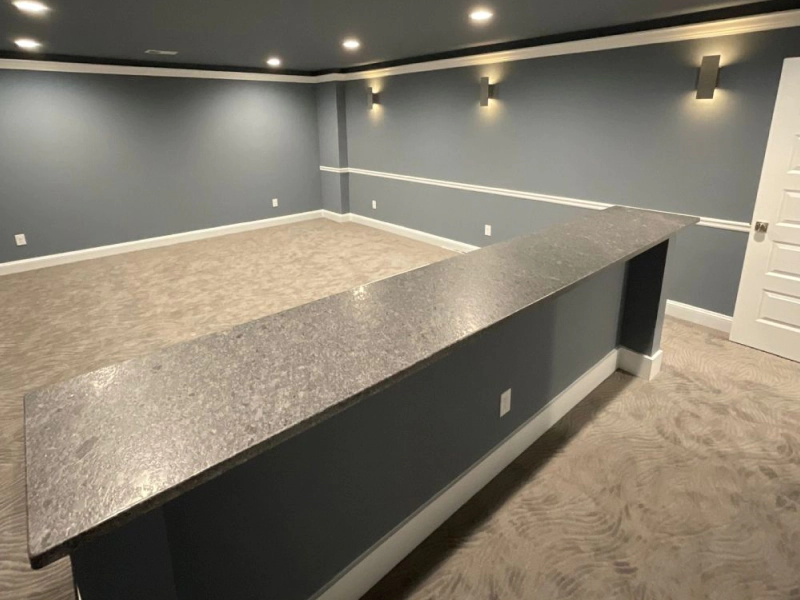 bar in an empty refinished basement